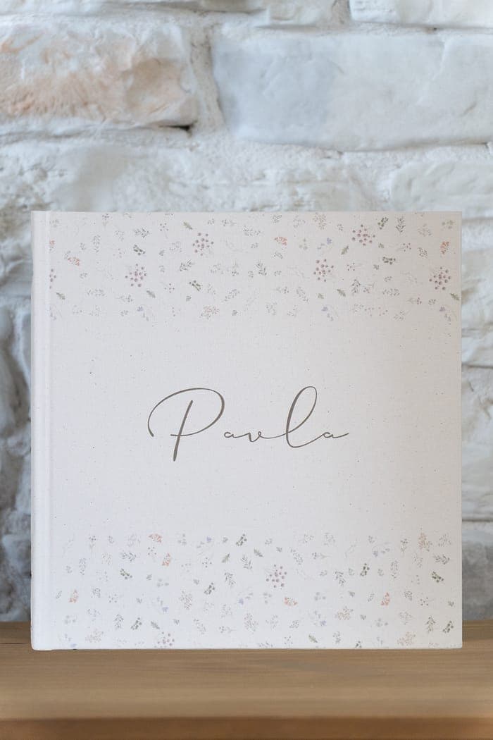 Floral cover, small scattered sprigs printed on cream linen.